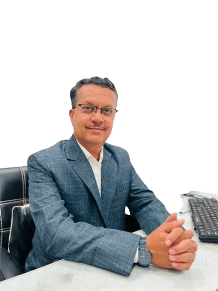 Dr. Mohammad Imran Shaikh seated for consultation